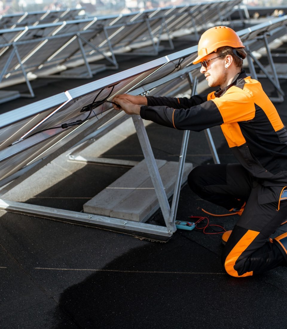 Electrician connecting solar panels